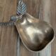 Small vintage brass trinket dish in the shape of a pear.