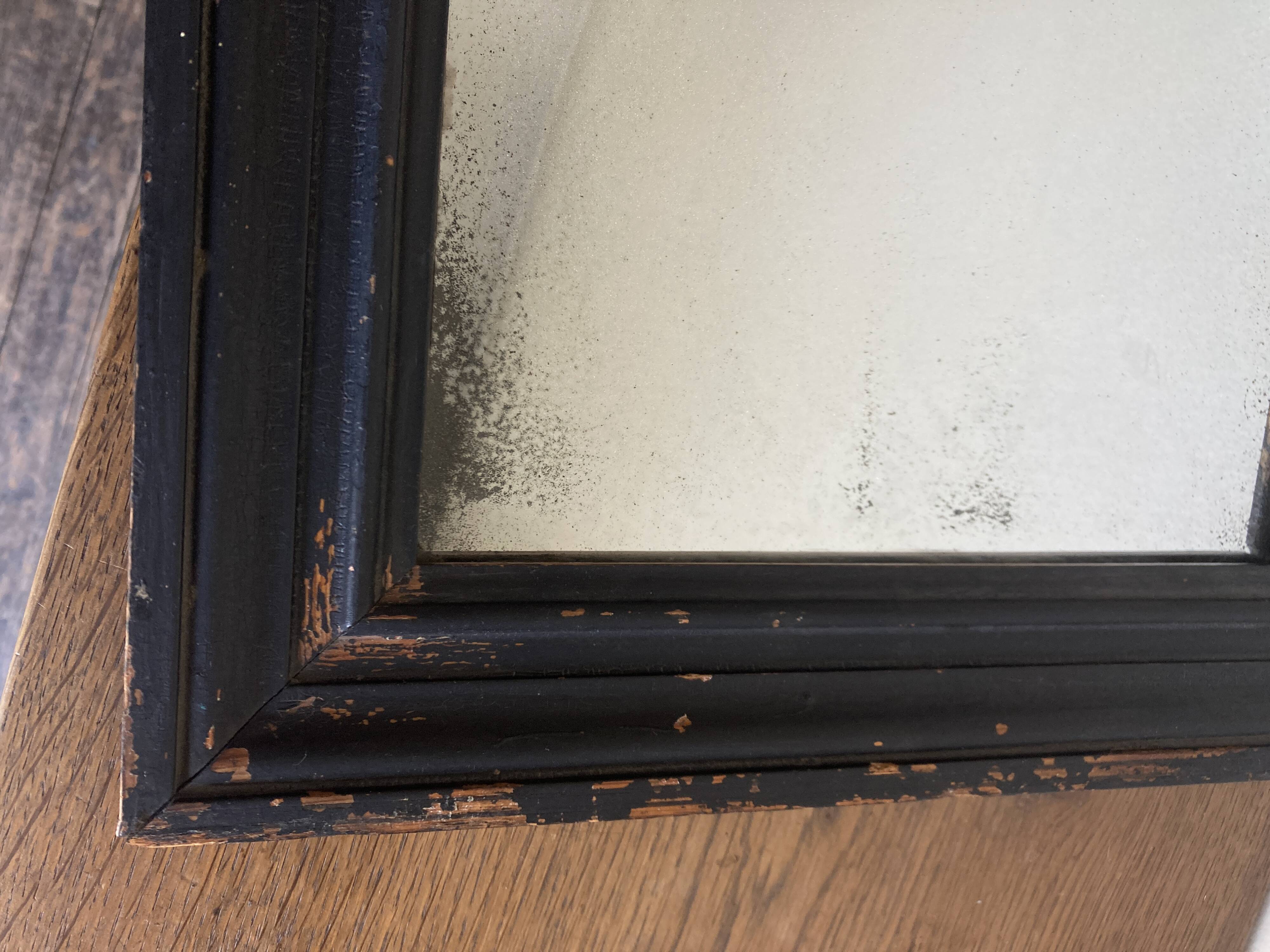 19th century blackened mirror with pitted glass 34cm x 40cm