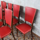 Lot of 8 vintage wooden chairs and red skai