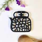 Old enameled cast iron trivet