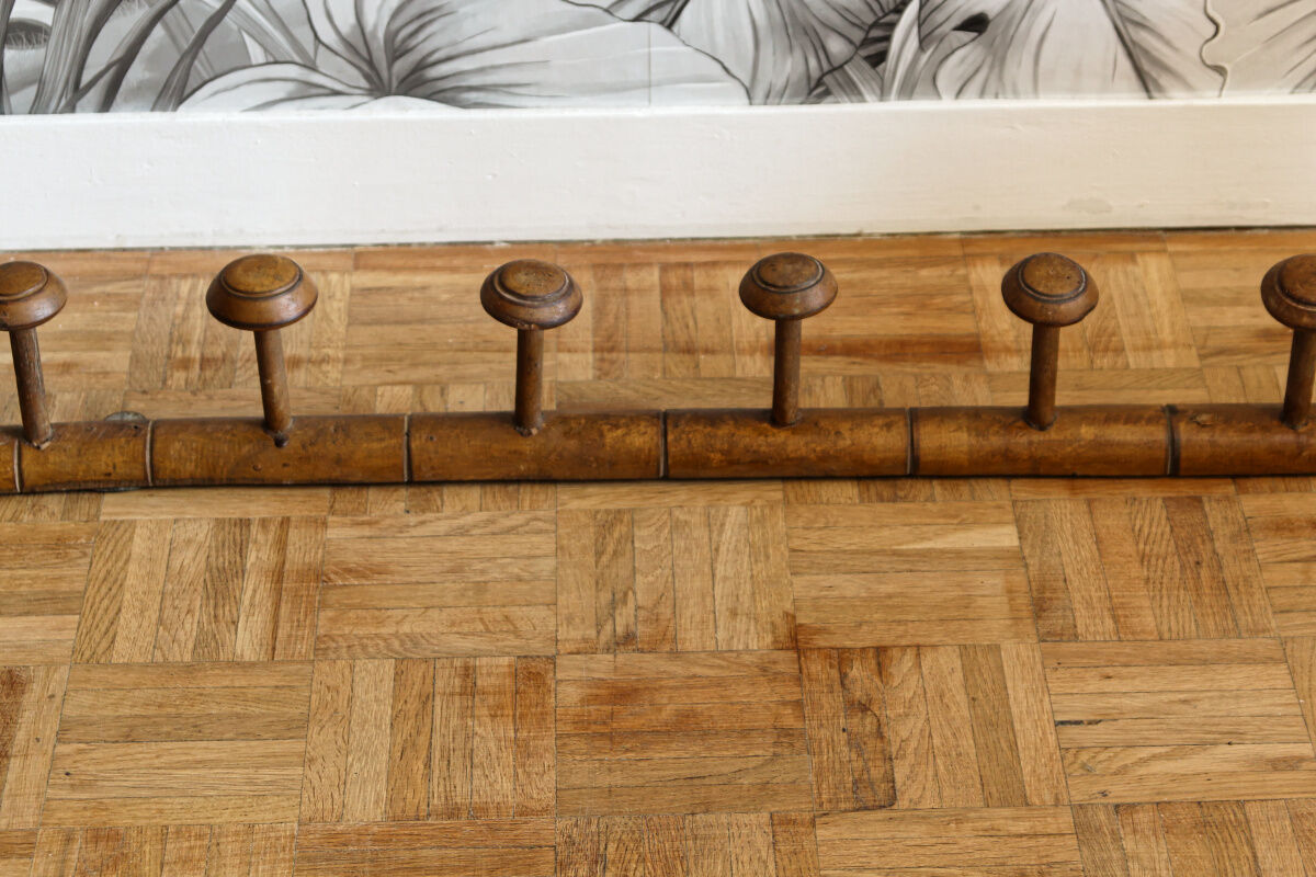 Wall mounted wooden coat rack turned