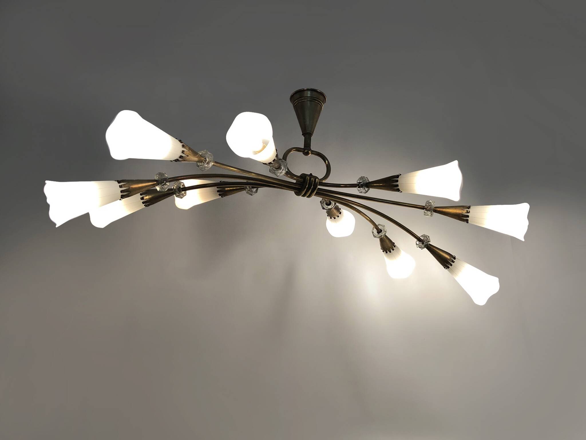 Modernist chandelier with 10 brass branches and white glass tubes, 1970s