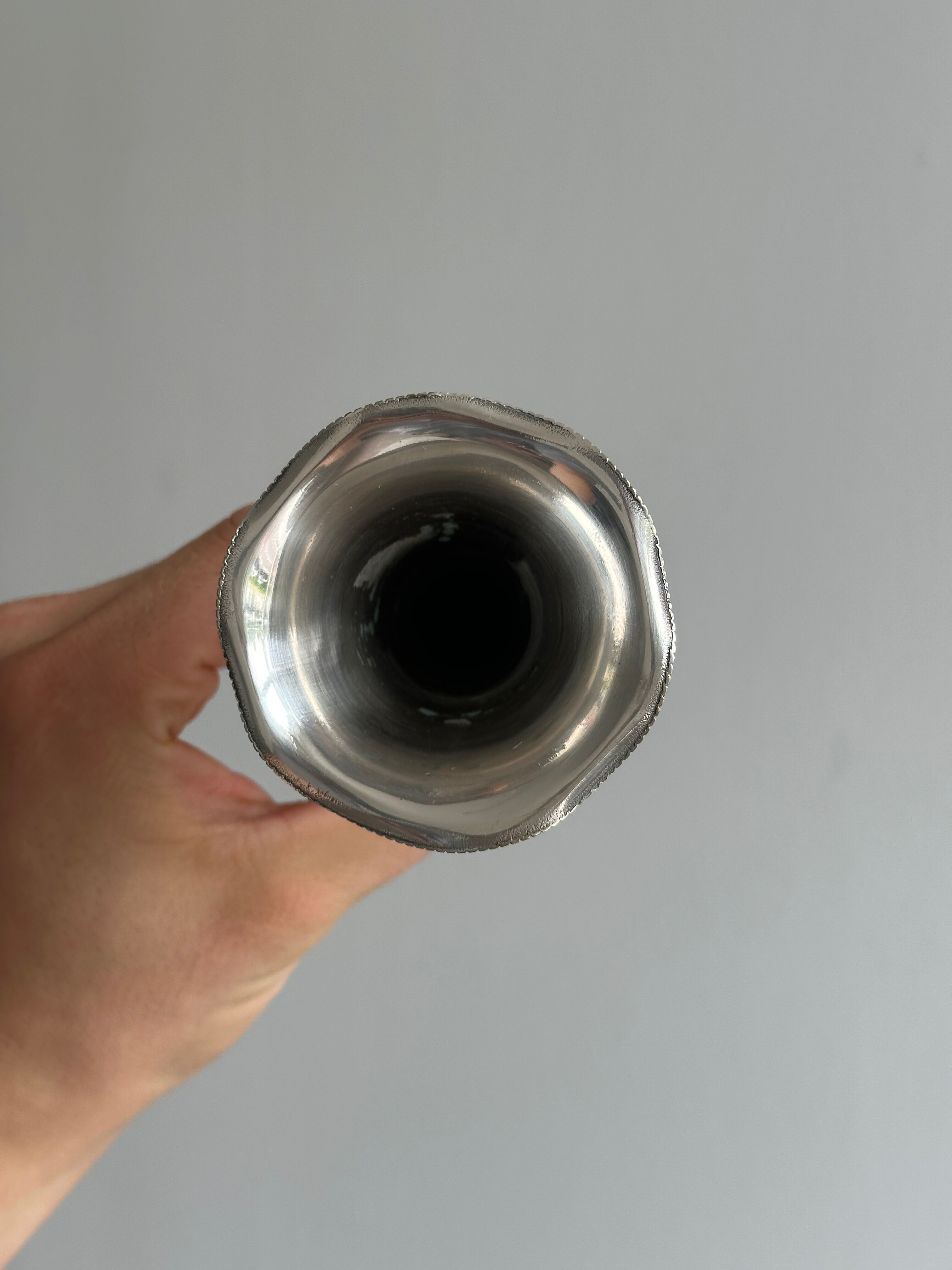 small antique silver-plated metal vase