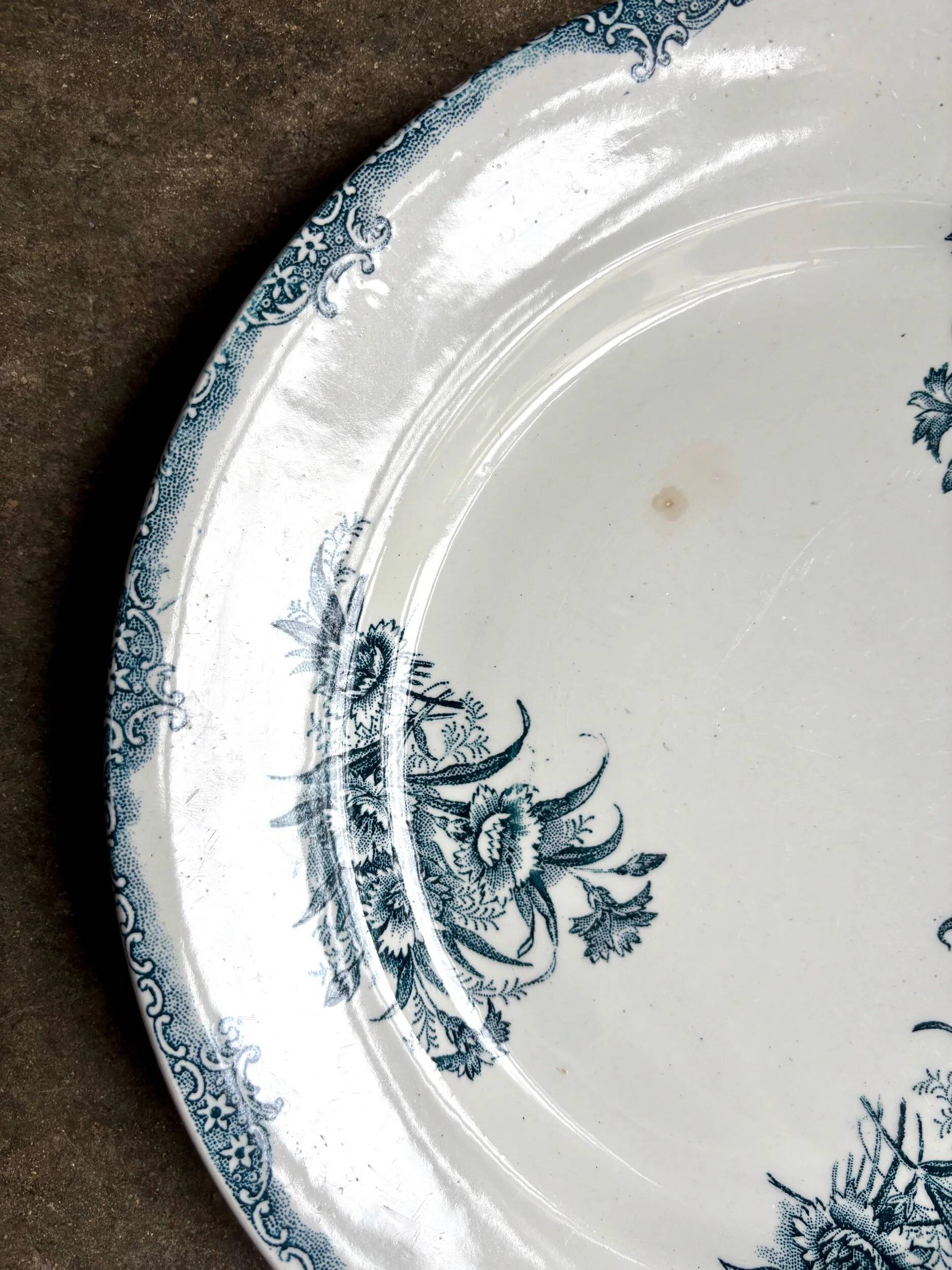 Léon Graves round dish in blue ironstone, "Oeillets" service