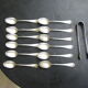 Set of twelve teaspoons and a sugar tongs