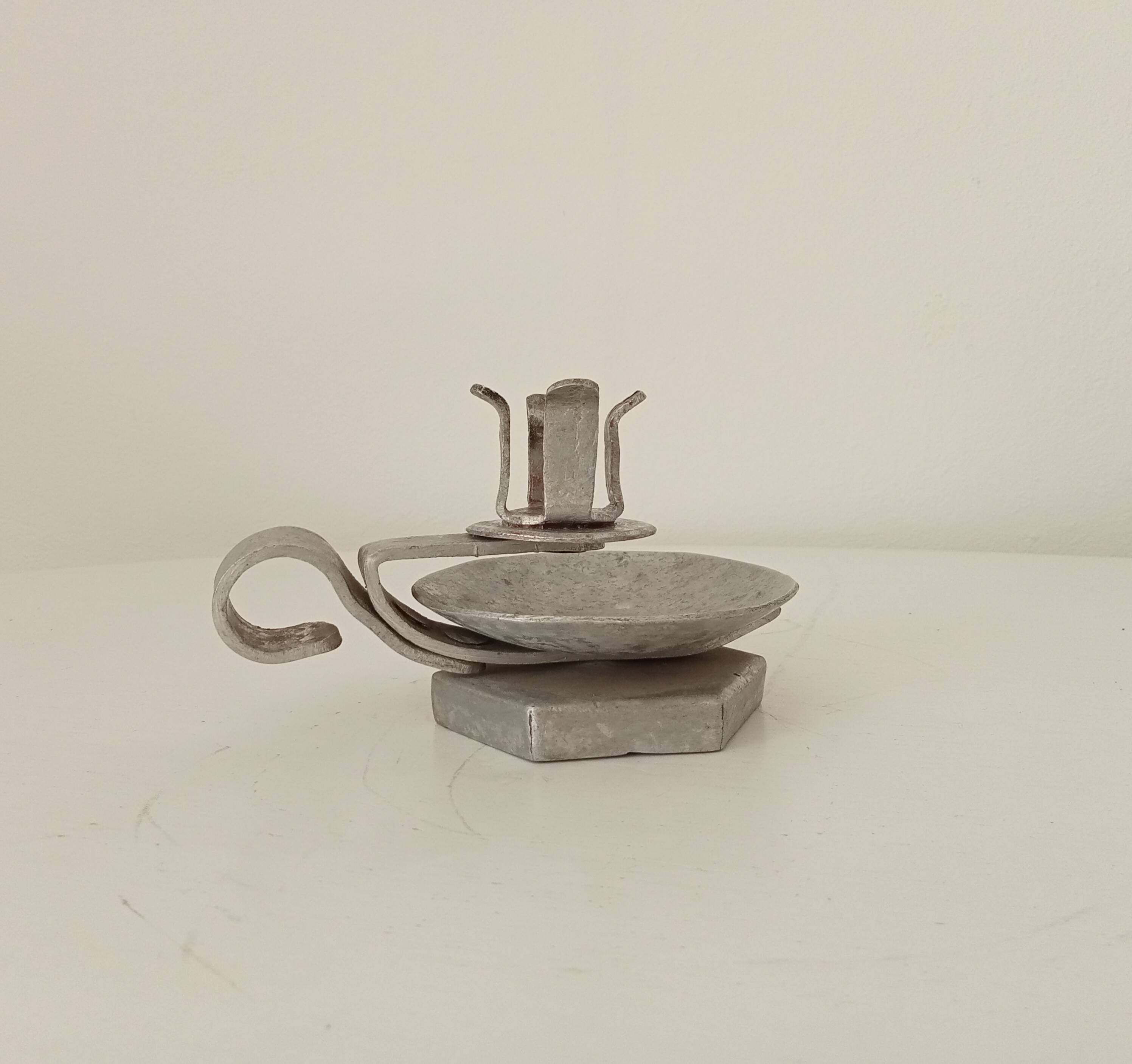 Vintage zinc hand candle holder