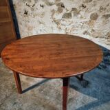 Vintage French round dining table in cherry wood, circa 1920.