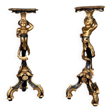 Paire de sellettes en bois sculpté, patine noire et dorée vers 1900