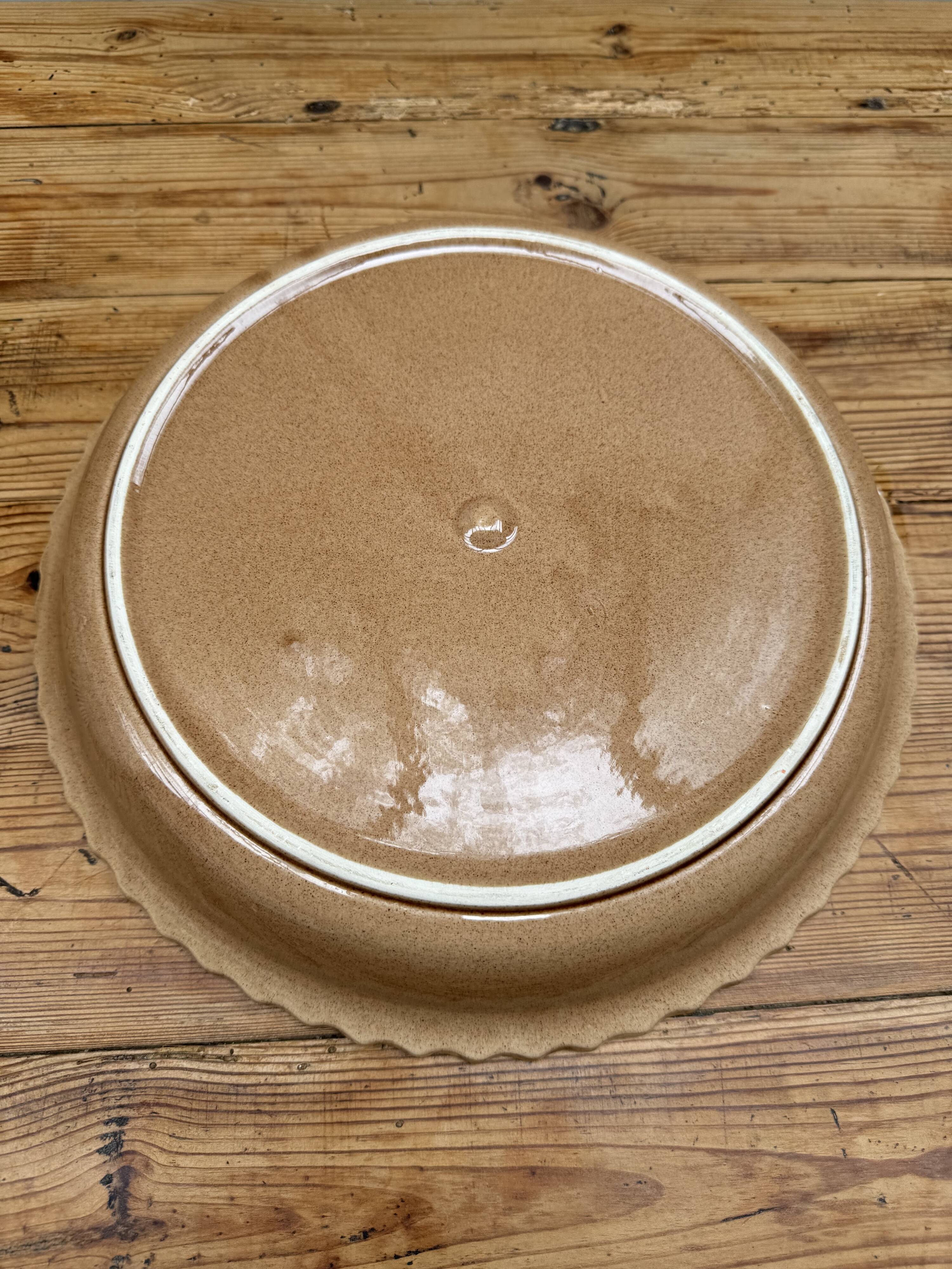 A trompe l’oeil strawberry pie dish