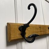Antique wooden coat rack with metal hooks