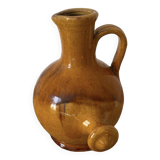 Provençal jug in orange/caramel glazed earthenware