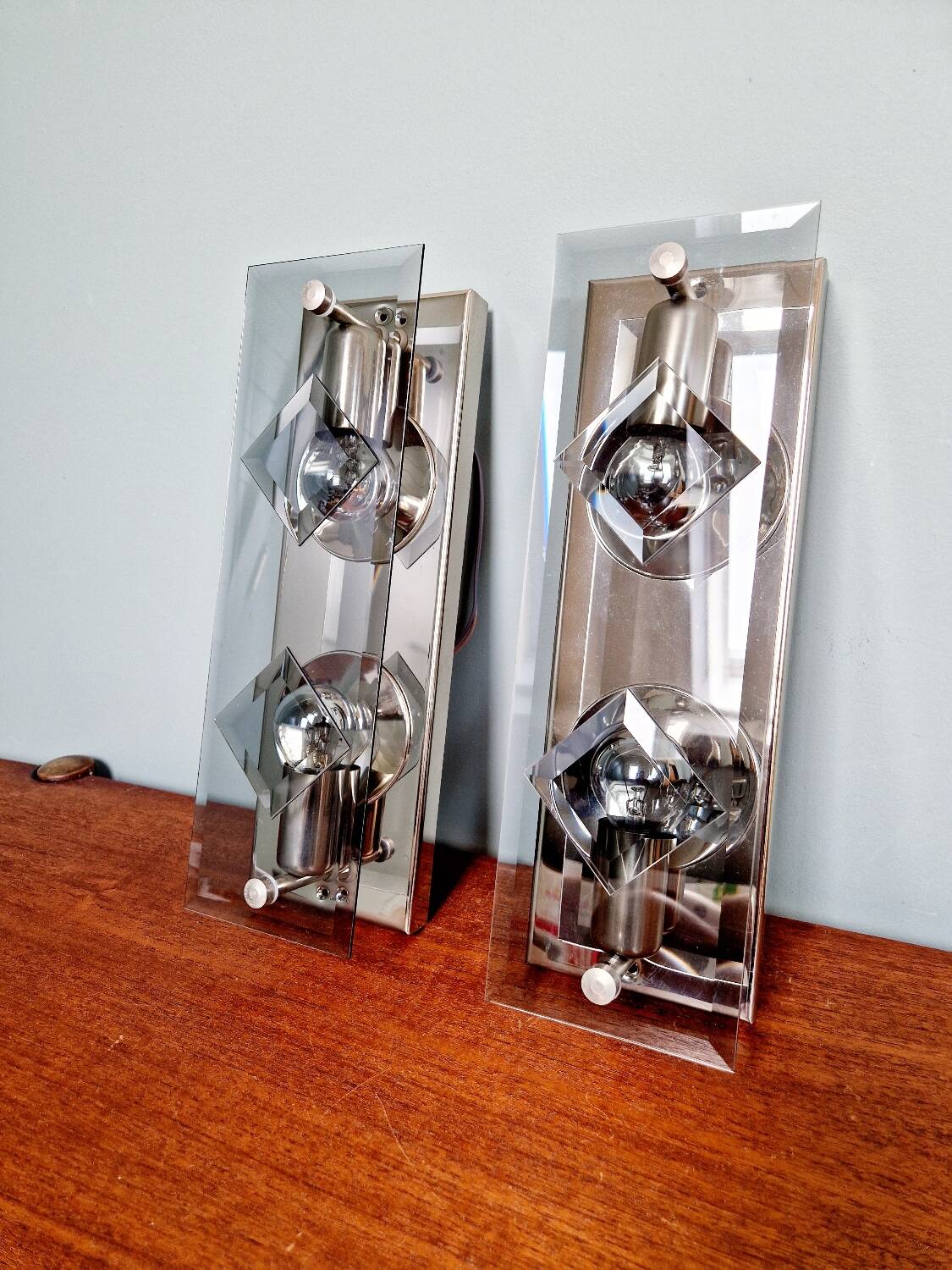 Pair of chrome metal and smoked glass wall sconces, 1970s.