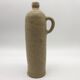 Old hot water bottle in glazed stoneware, beige color