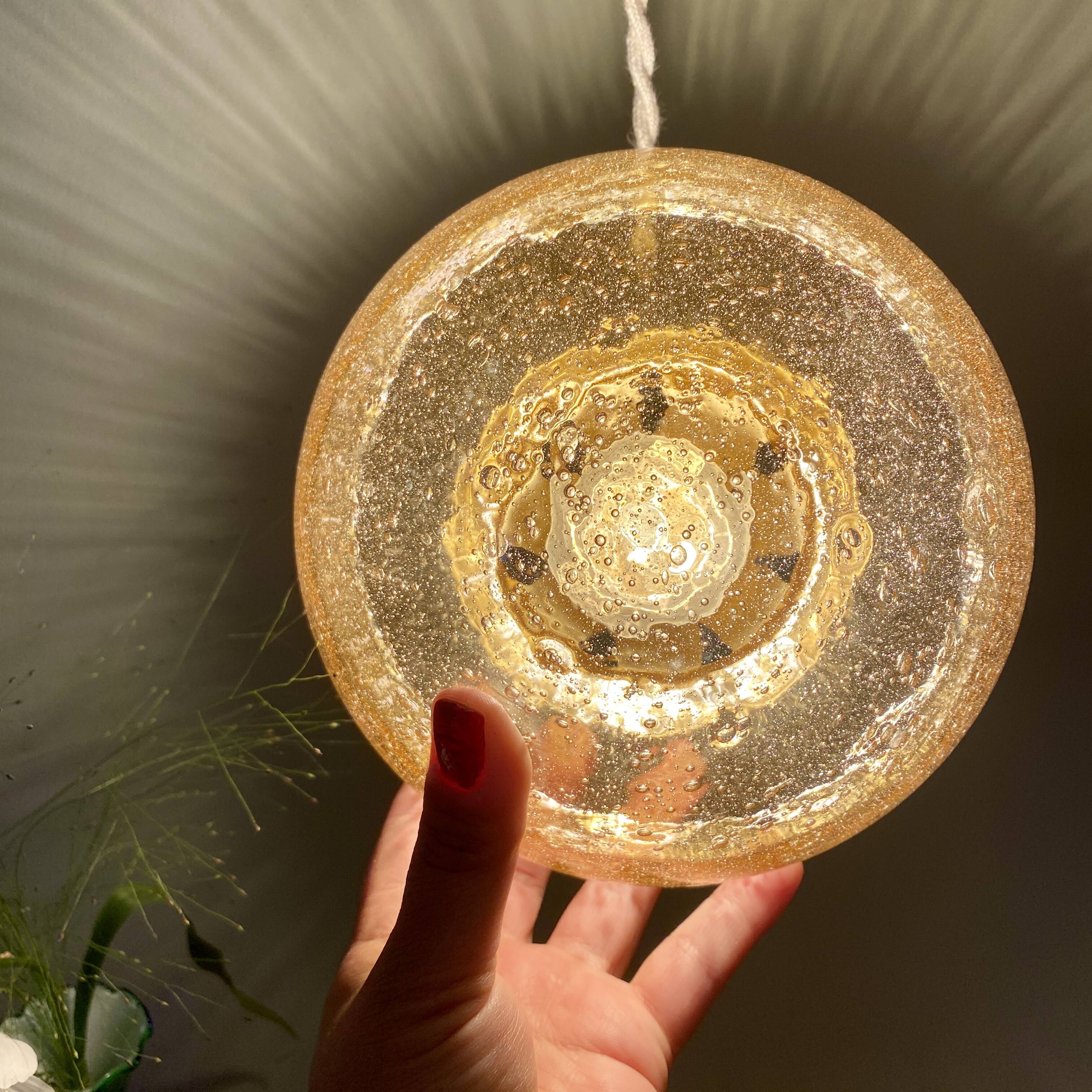 Vintage globe pendant light in bubbled amber glass