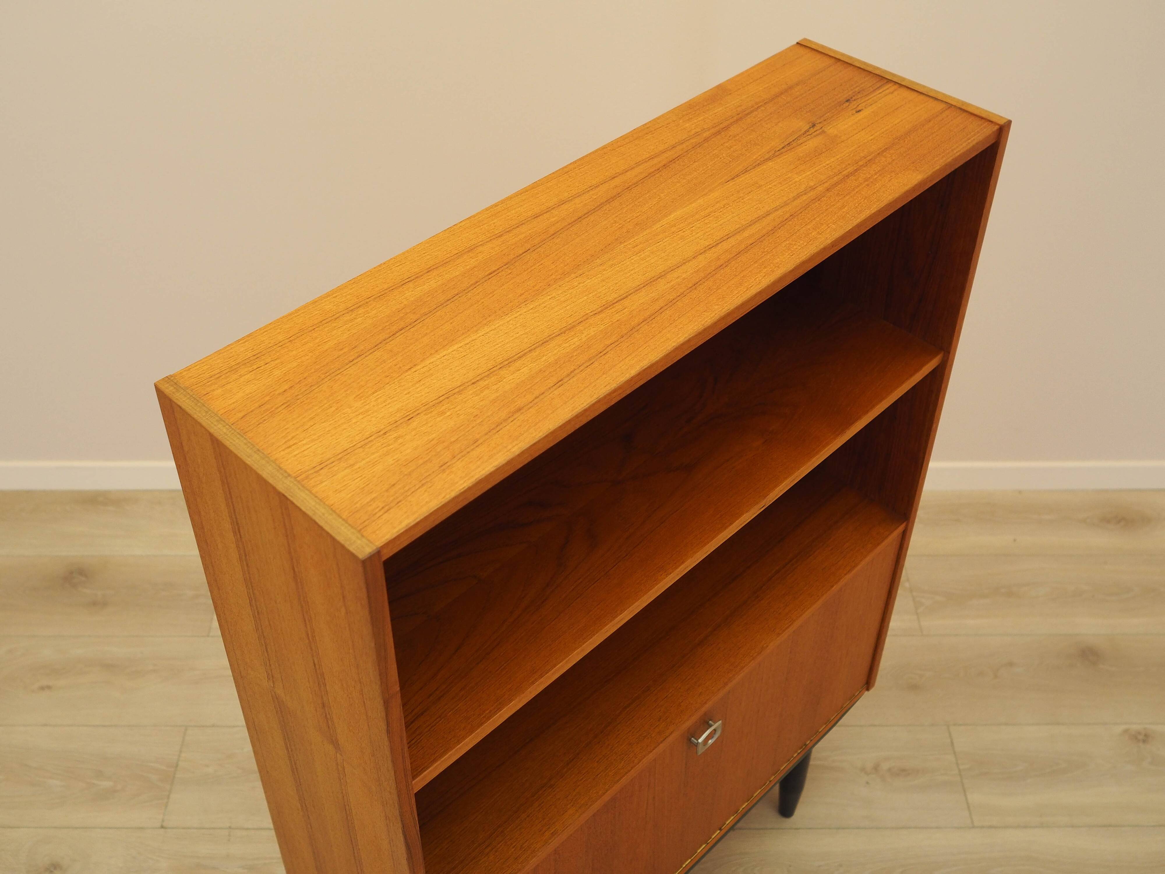 Danish teak-veneered bookcase with a bar and adjustable shelves, 1970s.