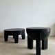 Black mango wood tripod side table with a semi-spherical top, height: 45 cm, diameter: 44 cm.