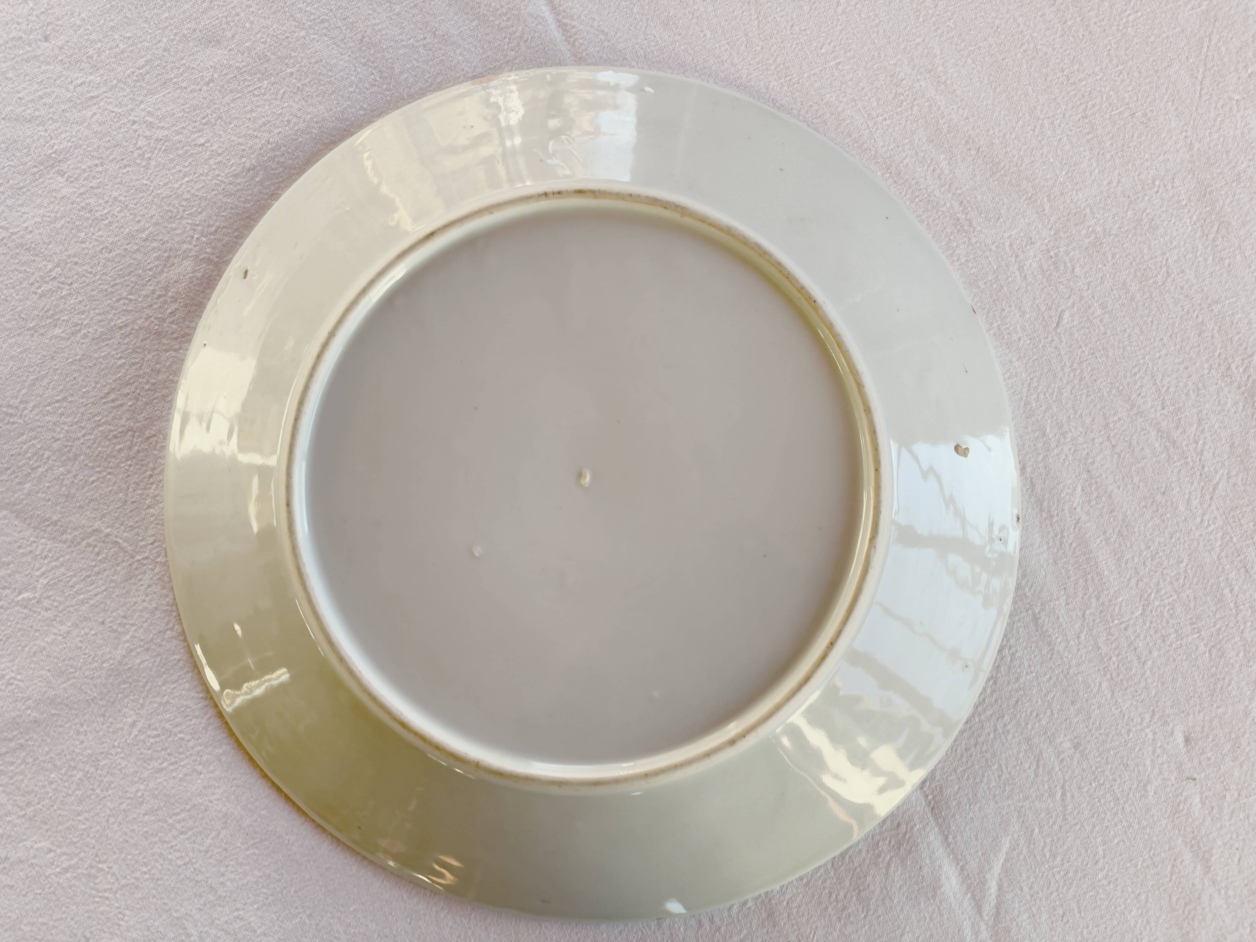 Yellow porcelain plate with saturated and vivid colors. Handmade in Japan