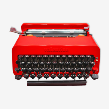 Vintage red Olivetti Valentine typewriter with its briefcase