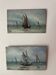 A pair of old paintings on wood.