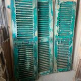 Old green shutter blinds