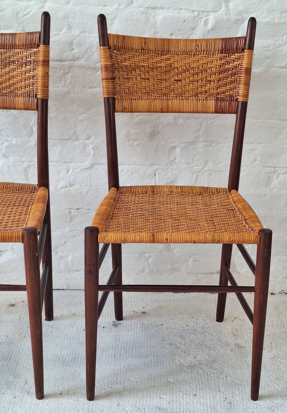 Four teak dining chairs with patinated cane after Gio Ponti, Italy 1960s