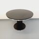 Vintage dining table in melamine with a black wood effect and chrome metal.