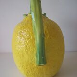 Vintage pitcher has form of lemon