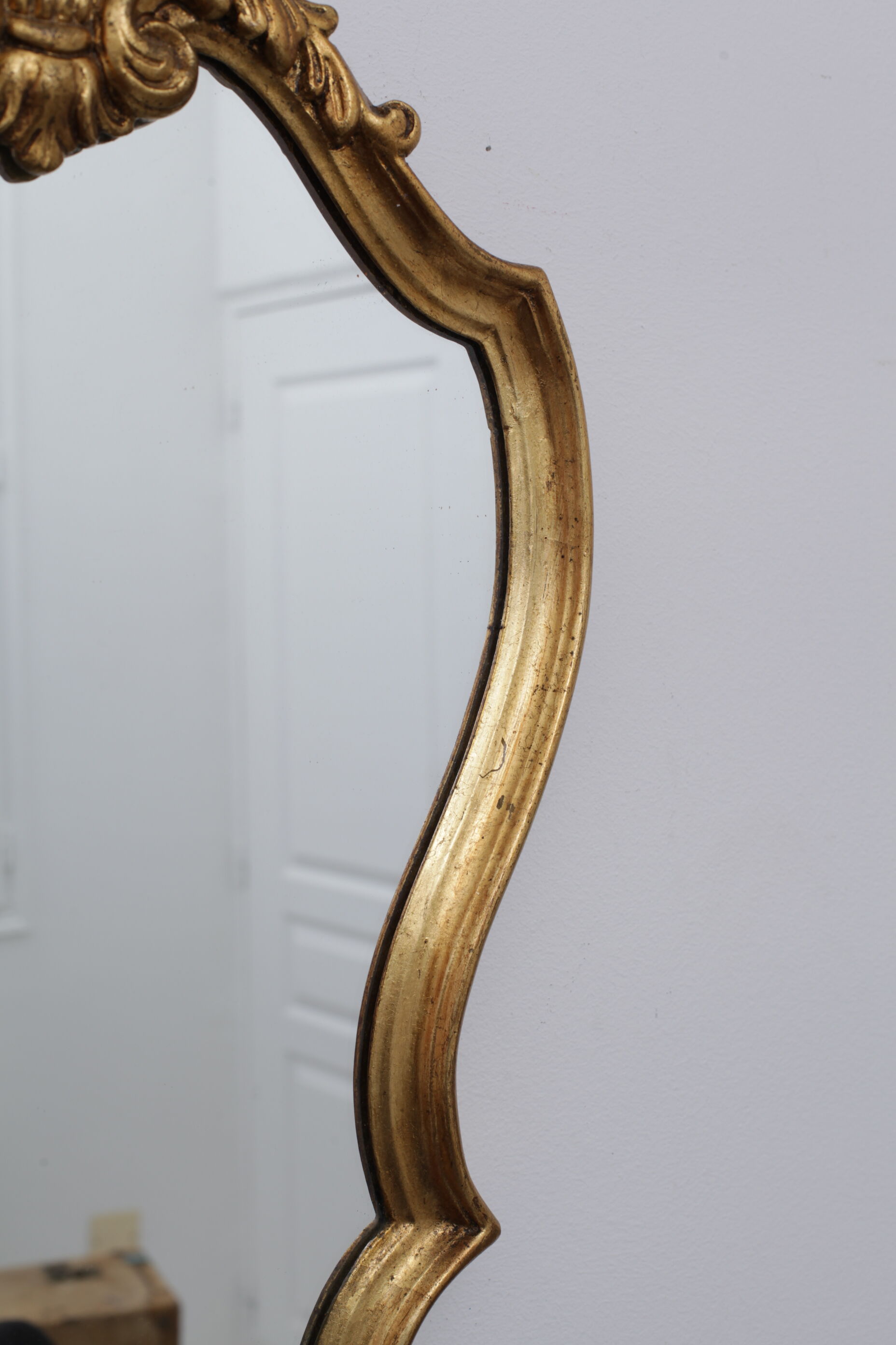 Golden rococo mirror with gold leaf