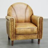 Unique children’s armchair made of cowhide leather in Art Deco style, featuring a light cognac color