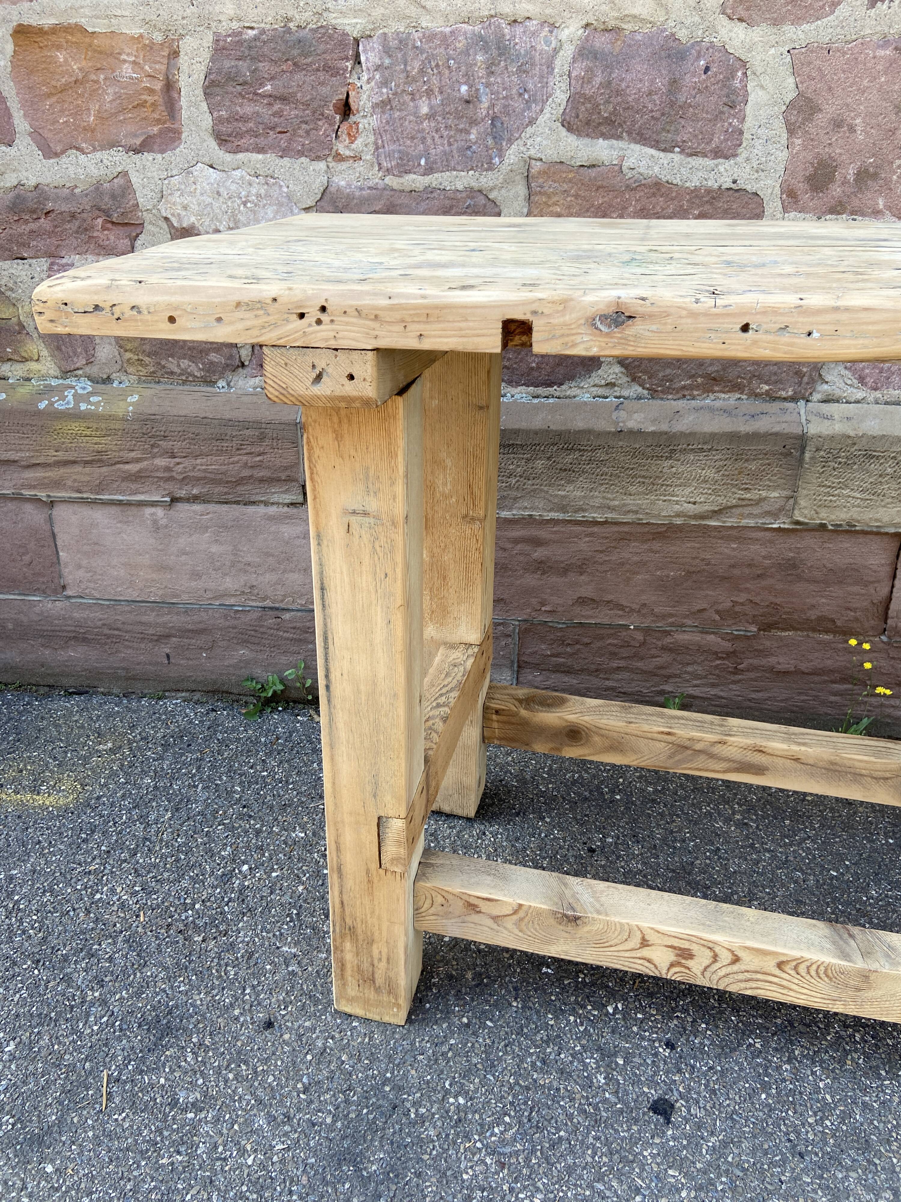 Primitive industrial table workbench in raw natural wood vintage bohemian trade store