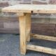 Primitive industrial table workbench in raw natural wood vintage bohemian trade store