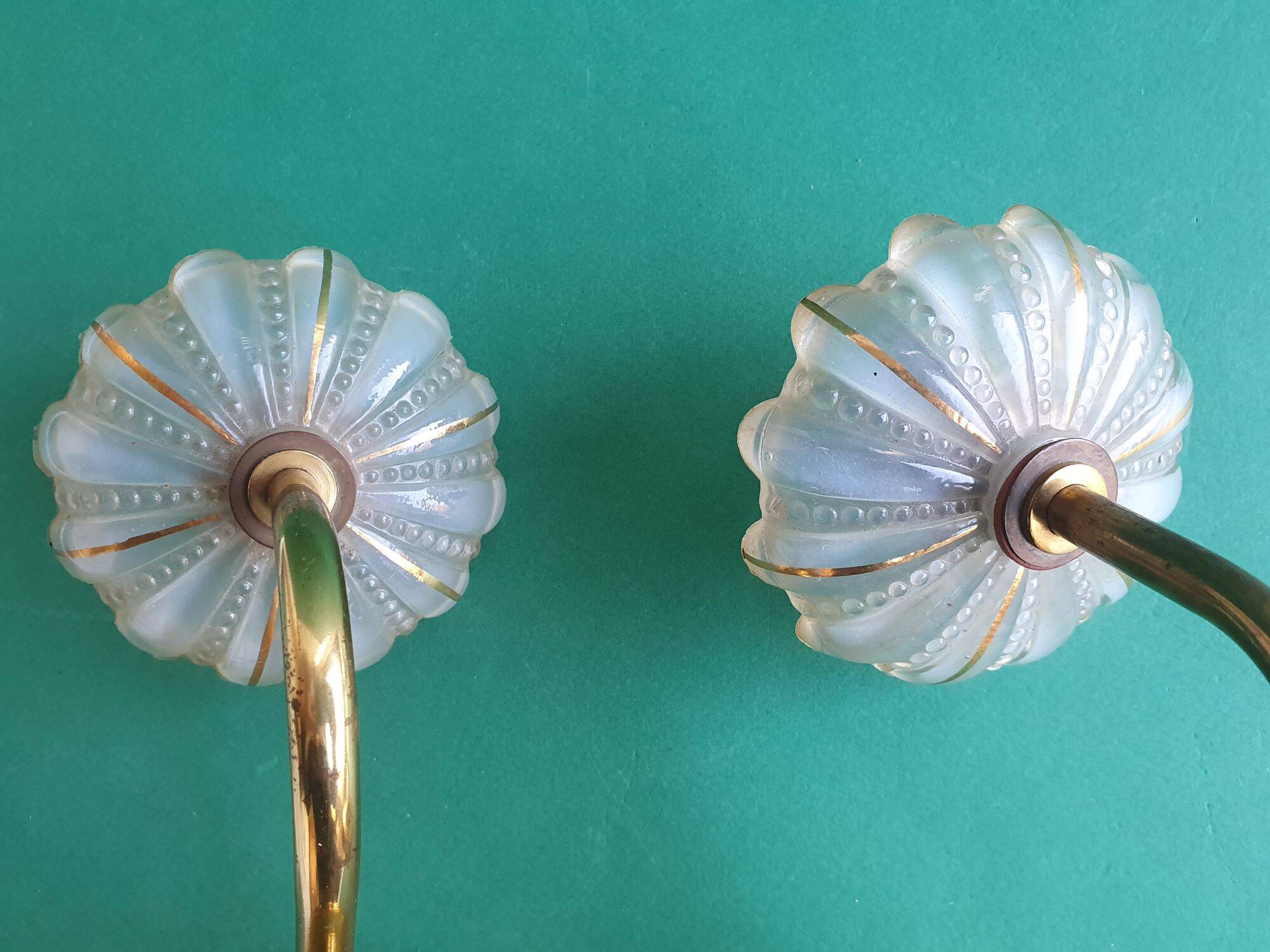 Pair of antique gold candlestick wall sconces