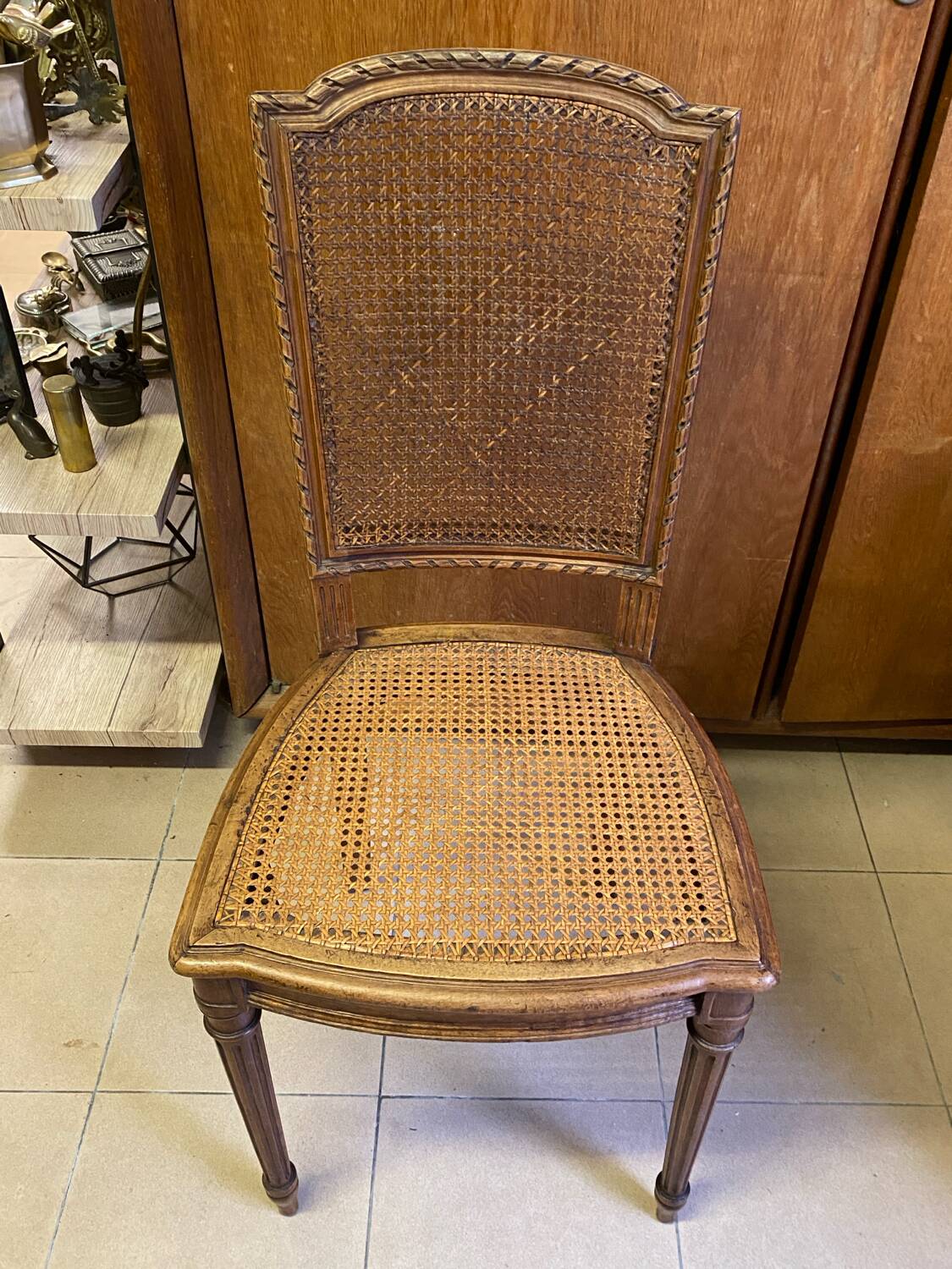 Chair with caned seat and back made of wood
