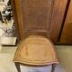 Chair with caned seat and back made of wood