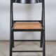 Folding chair seated in cannage