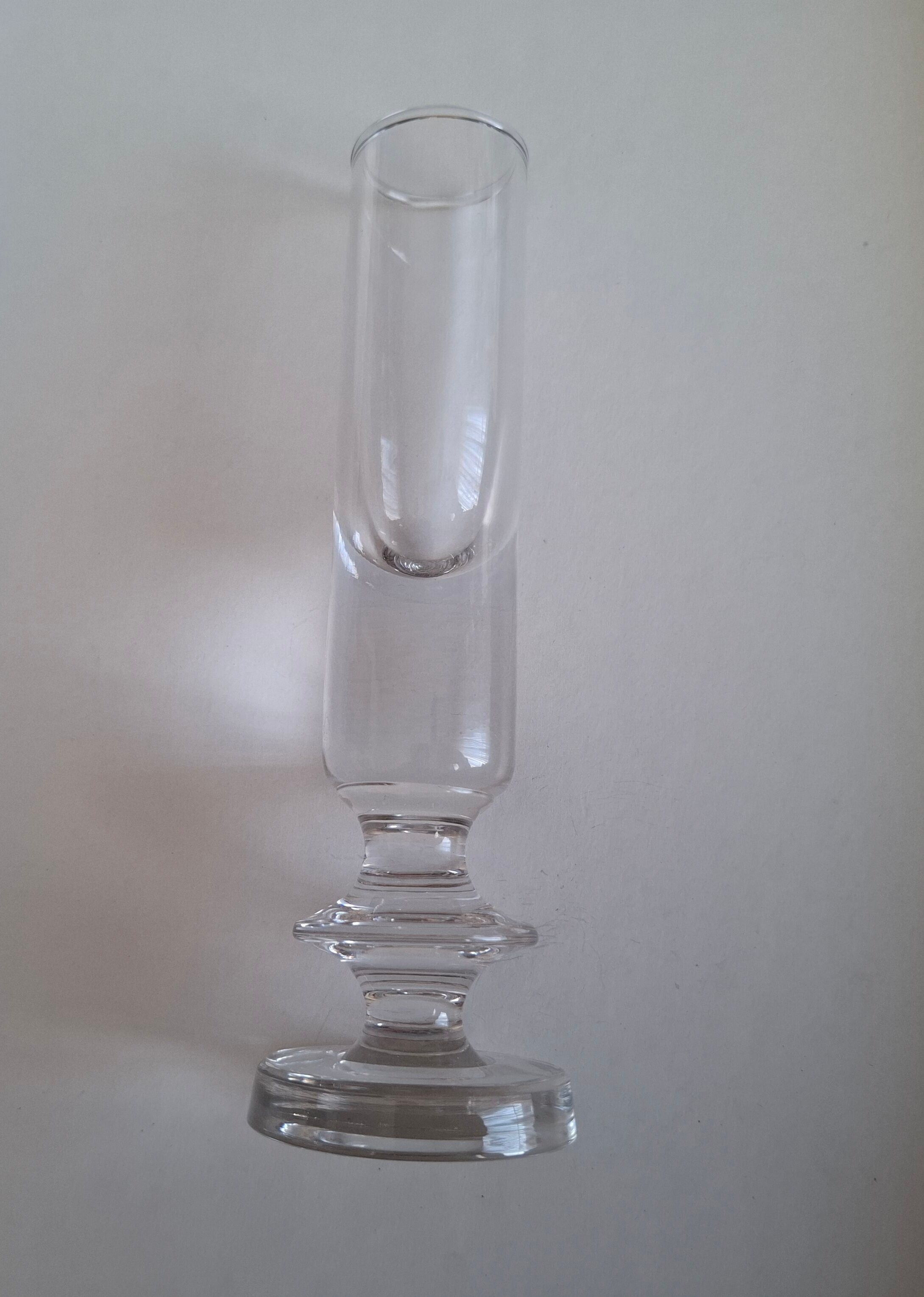 Antique single-stem vase in the shape of a candlestick.