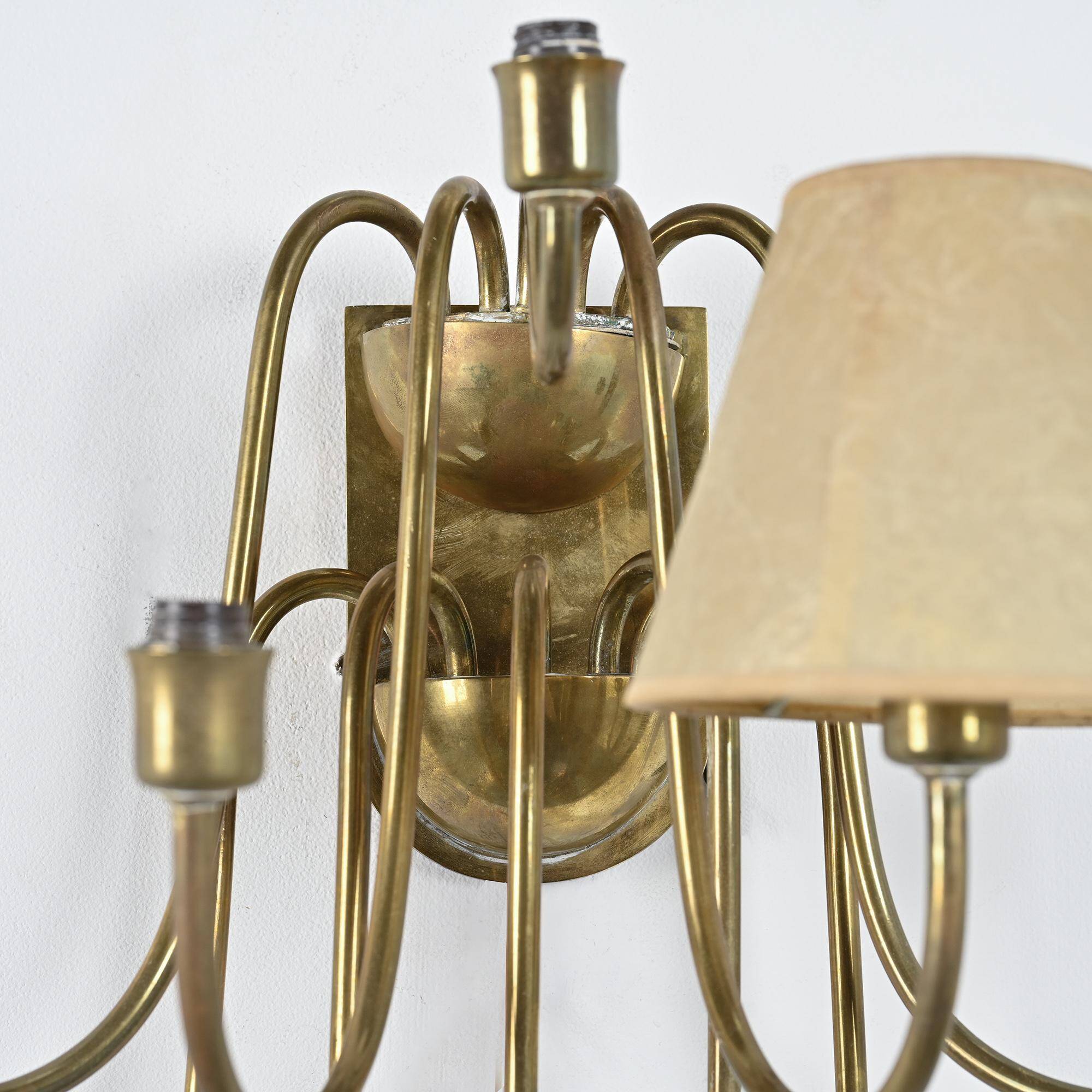Wall sconce with nine arms in brass, France, circa 1950.