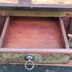 Furniture low in colorful wood. 12 drawers and 1 door