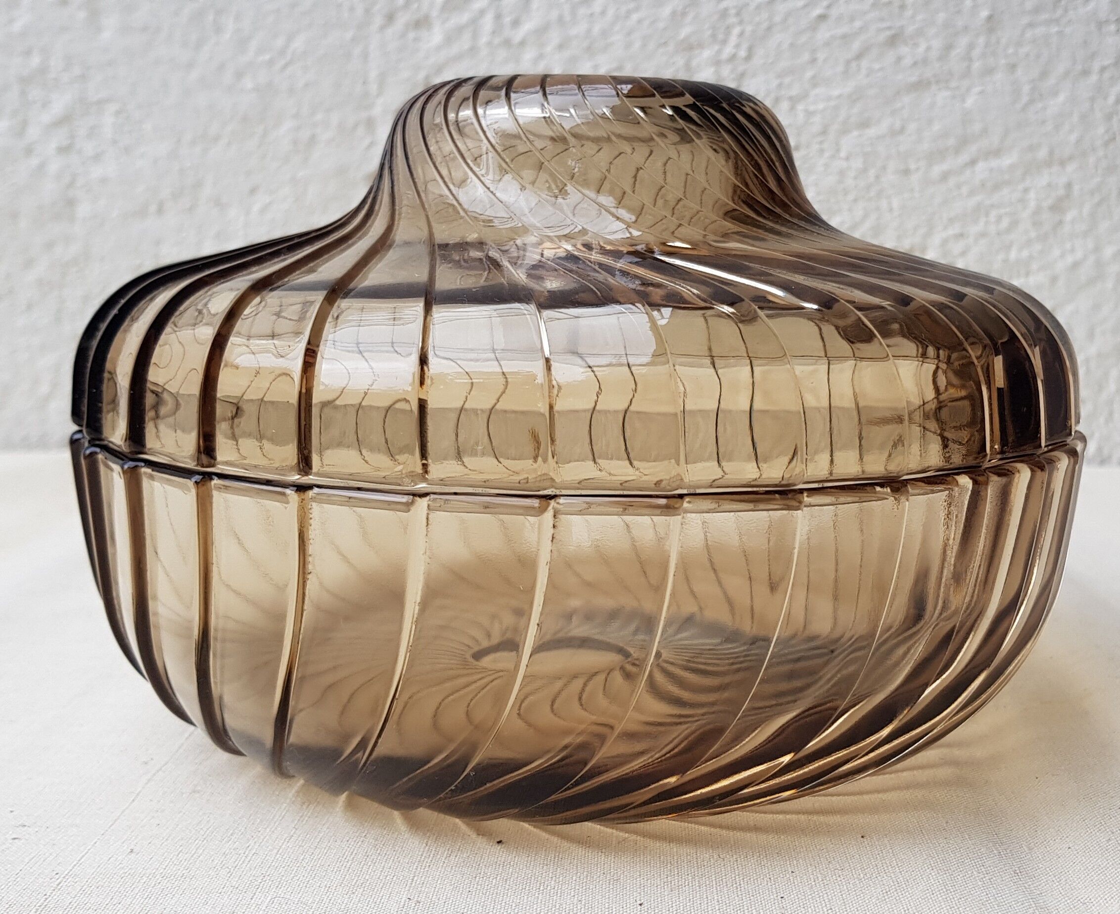 Empty amber glass pocket with lid