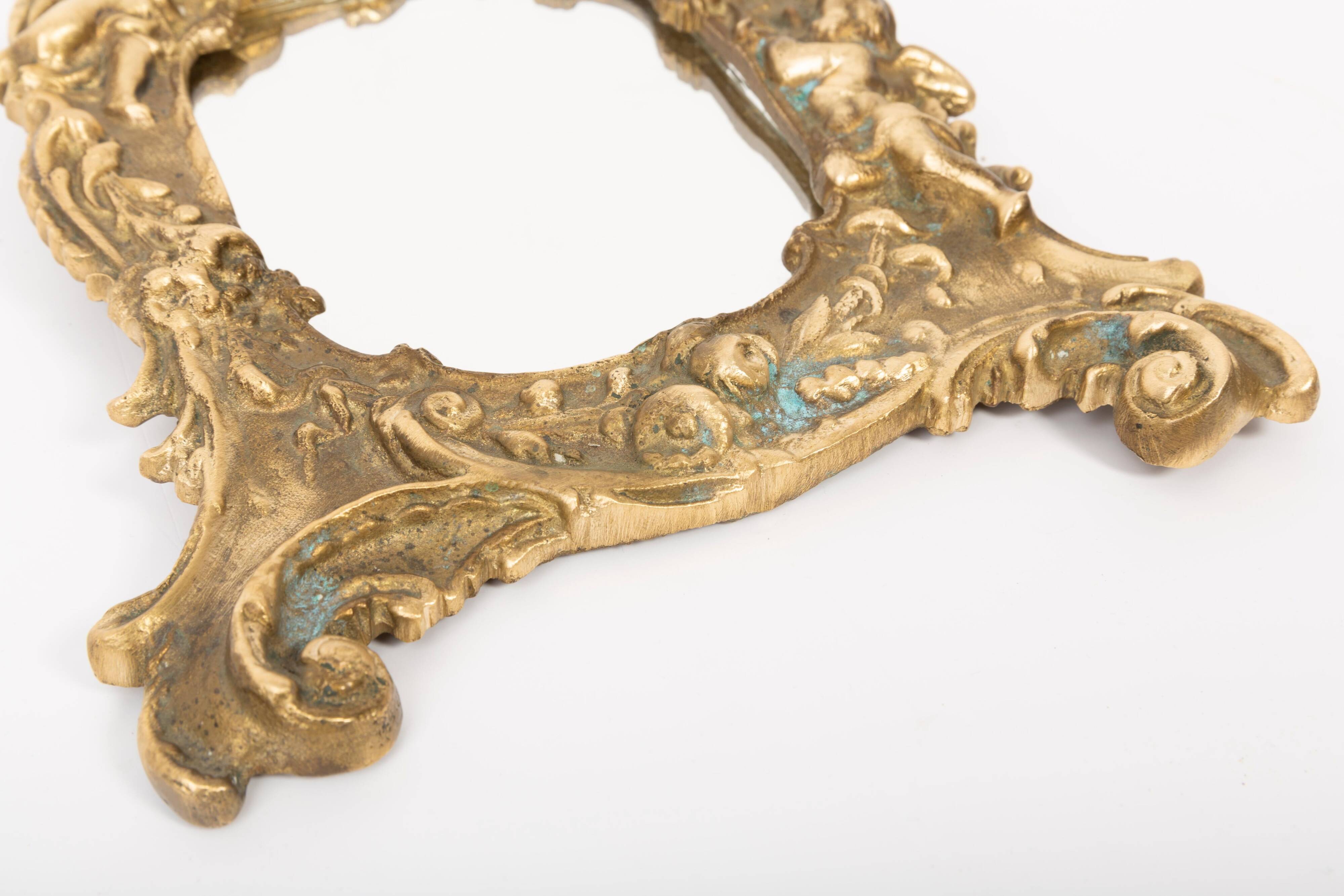 Miniature vintage gold mirror with angels, Italy, 1960s