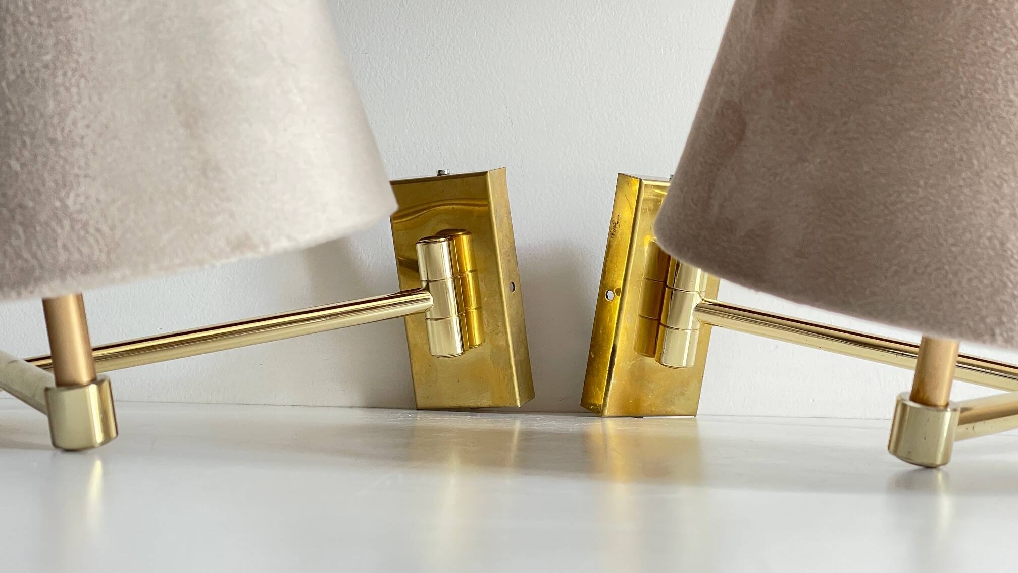 articulated brass and velvet wall light