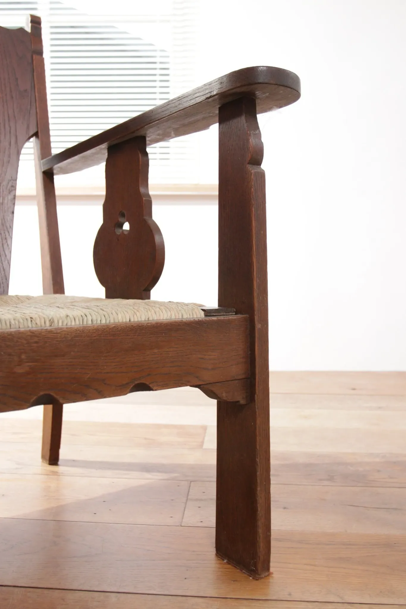Pair of low Brutalist oak lounge chairs with new rush seats – circa 1935