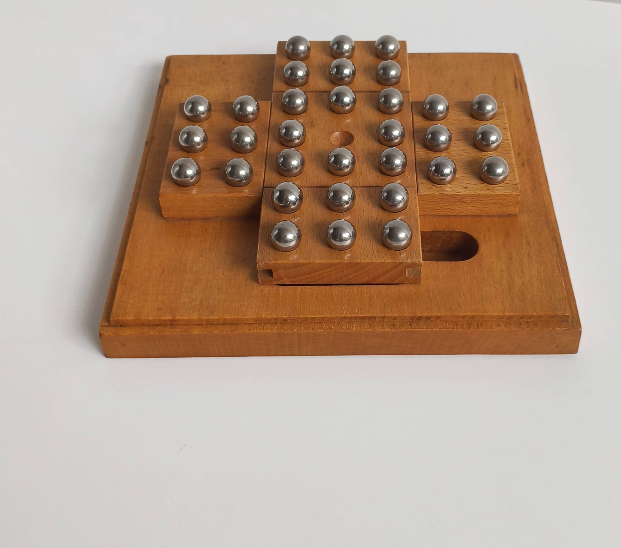 Solid wood and chrome steel solitaire game