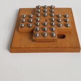 Solid wood and chrome steel solitaire game