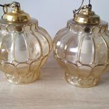Two Globe chandeliers in molded glass in a beautiful amber color