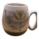 Set of two ceramic mugs signed Yvon ROY.