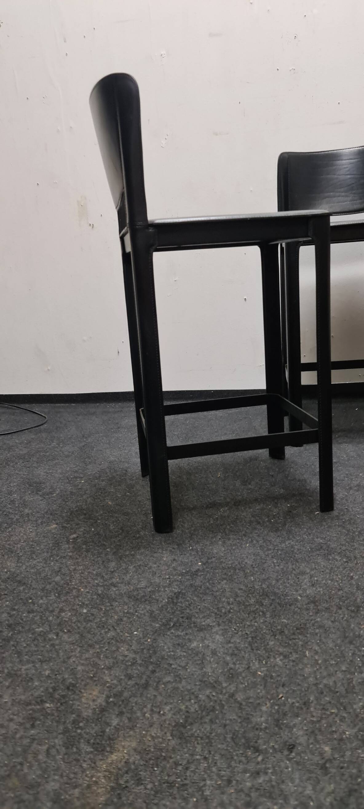 A set of four Italian leather bar stools by Matteo Grassi