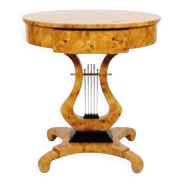 An Empire round side table made of beech wood and elm burl with 1 drawer.