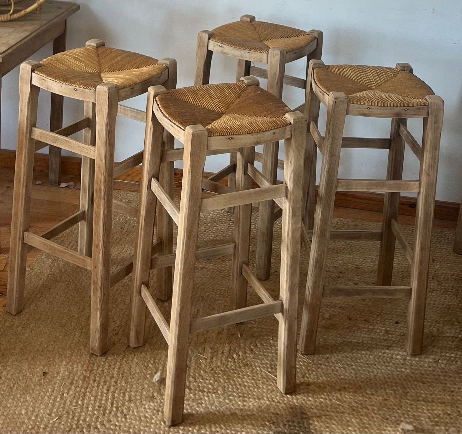 Set of 4 vintage high bar stools in raw solid oak and straw.