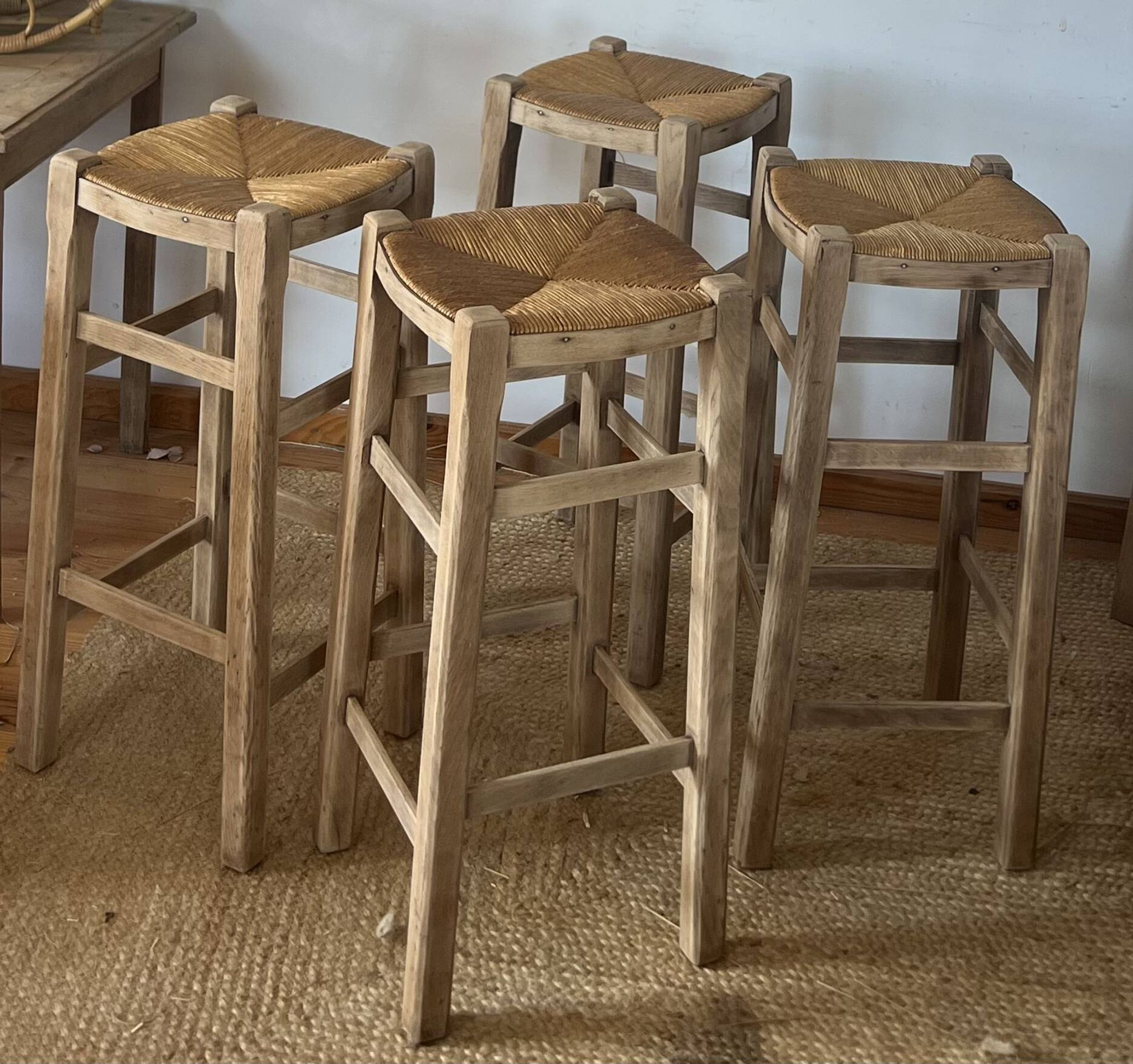 Set of 4 vintage high bar stools in raw solid oak and straw.